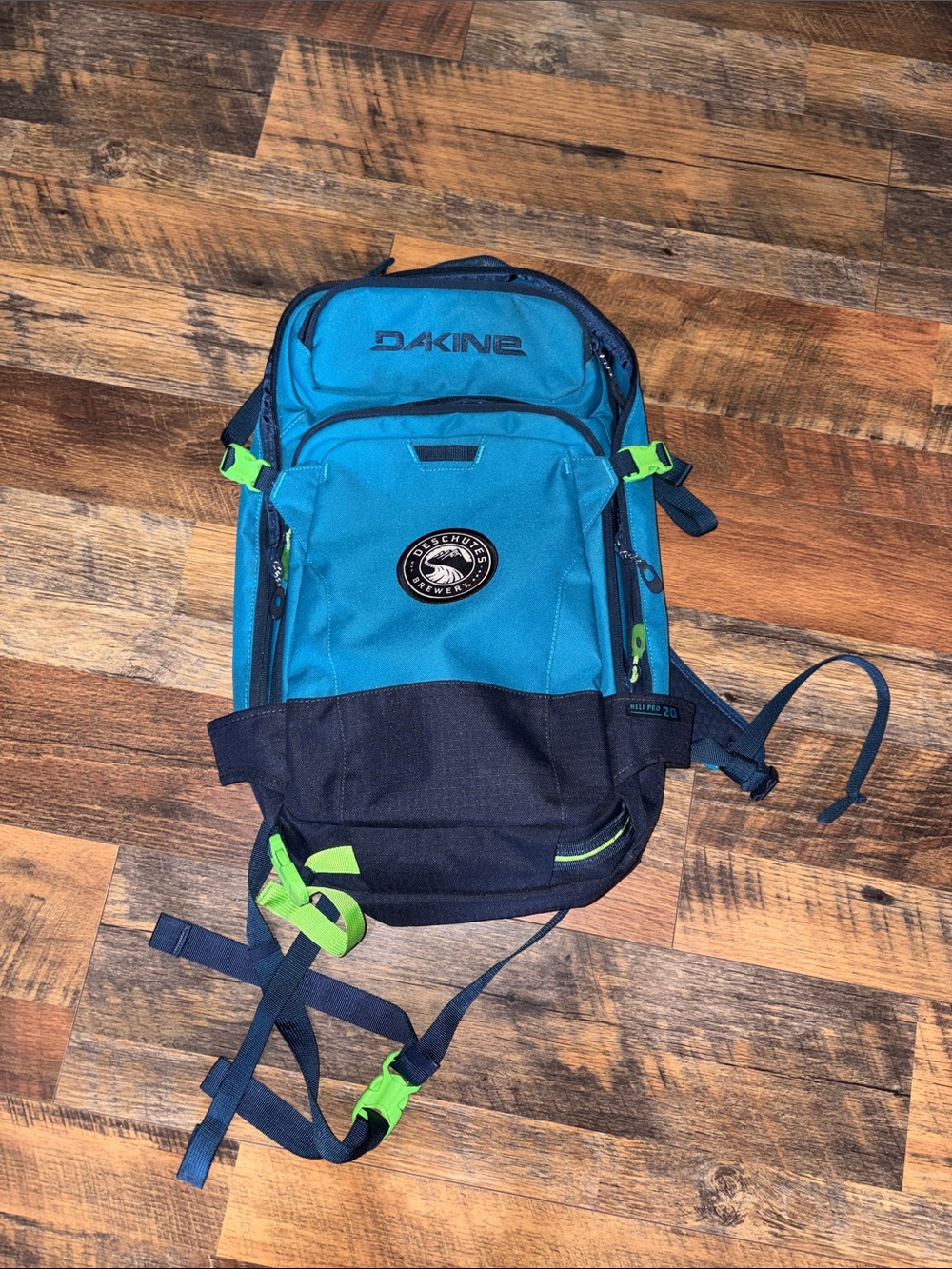 Dakine Heli Pro 20L backpack featuring a Deschutes Brewery logo